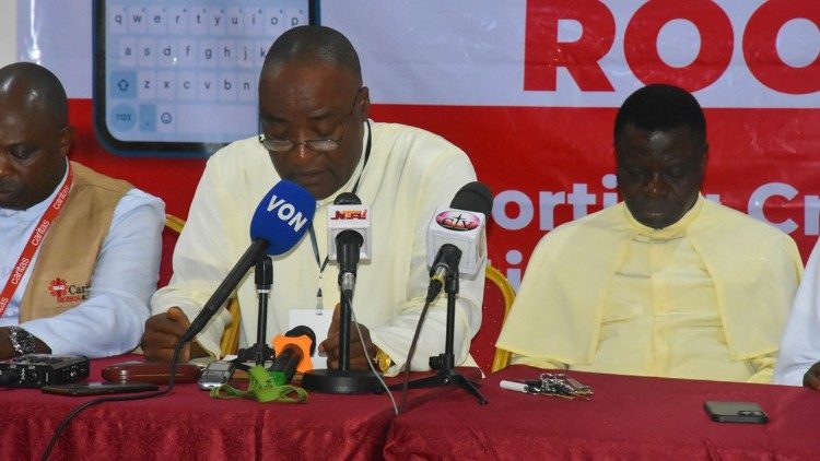 (File) Fr Uchechukwu Obodochina (centre) - Caritas Nigeria