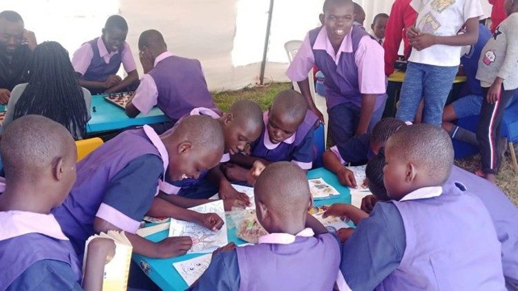 St. Martin de Porres learners, shading pictures and playing games after attending a National Music Festival in Nyeri County.